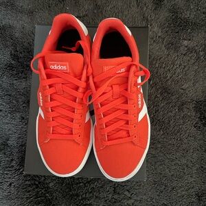 Adidas orange skateboard sneakers a Big kids size 7 and a women’s size 8